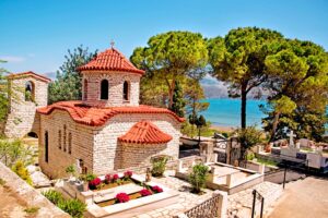 Beautiful landscape with an ancient church at the cemetery near the sea in Argostoli, Kefalonia, Greece. Stunning amazing charming places. prominent tourist towns.